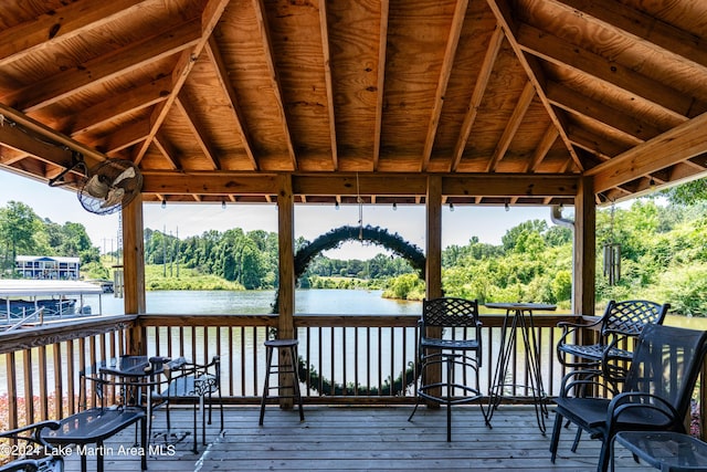 wooden terrace with a gazebo and a water view