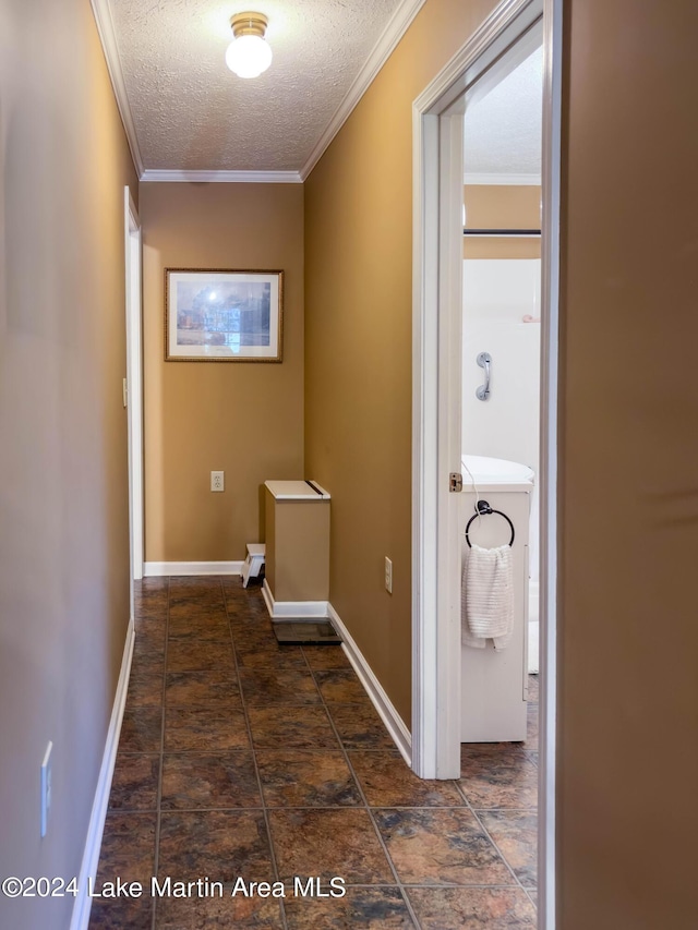 interior space with a textured ceiling and ornamental molding