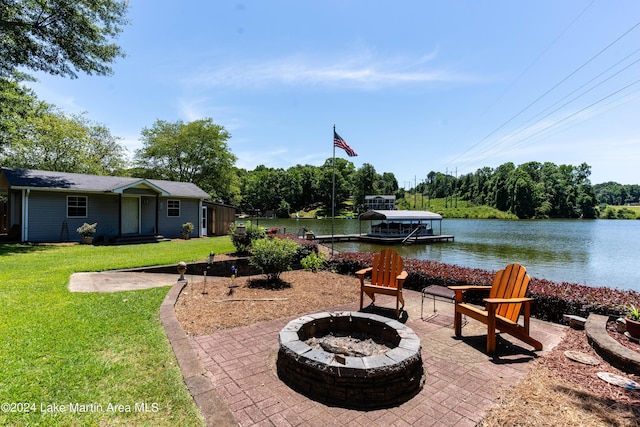 view of patio with a water view, an outdoor fire pit, and a dock