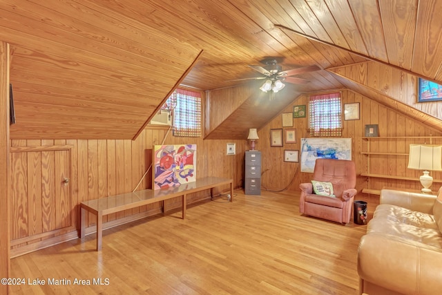 interior space with wood walls, light hardwood / wood-style flooring, and wood ceiling