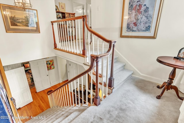 stairway featuring hardwood / wood-style floors