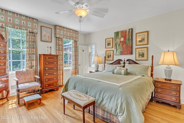 bedroom with hardwood / wood-style floors and ceiling fan