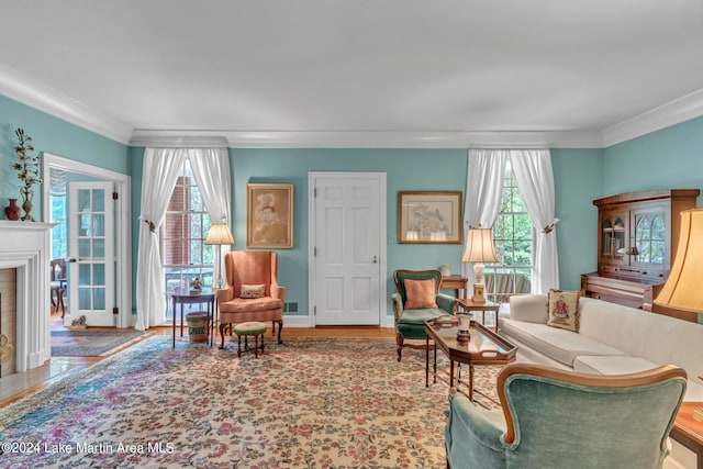 living room with wood-type flooring and crown molding