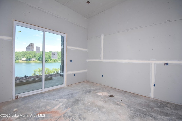 272 River Ridge Rd, Alexander City, AL 35010 - empty room featuring unfinished concrete flooring and a water view