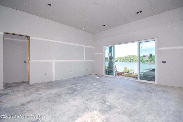 272 River Ridge Rd, Alexander City, AL 35010 - empty room with unfinished concrete flooring and a water view