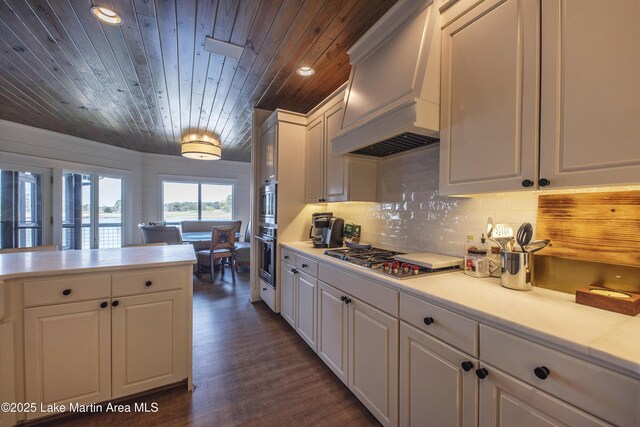 1220 Willow Way E, Alexander City, AL 35010 - kitchen featuring stainless steel gas stovetop, white cabinets, light countertops, and wood ceiling