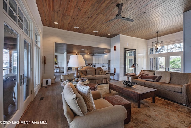 1220 Willow Way E, Alexander City, AL 35010 - living room with wood ceiling, wood finished floors, french doors, and ceiling fan with notable chandelier