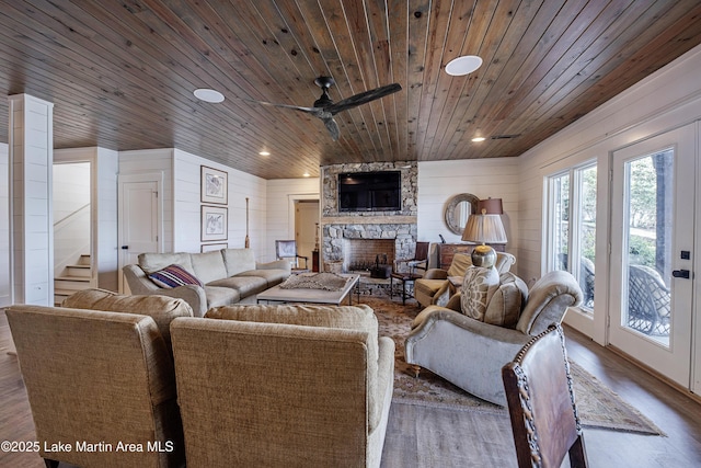 1220 Willow Way E, Alexander City, AL 35010 - living area featuring stairs, a fireplace, ceiling fan, wood finished floors, and wood ceiling