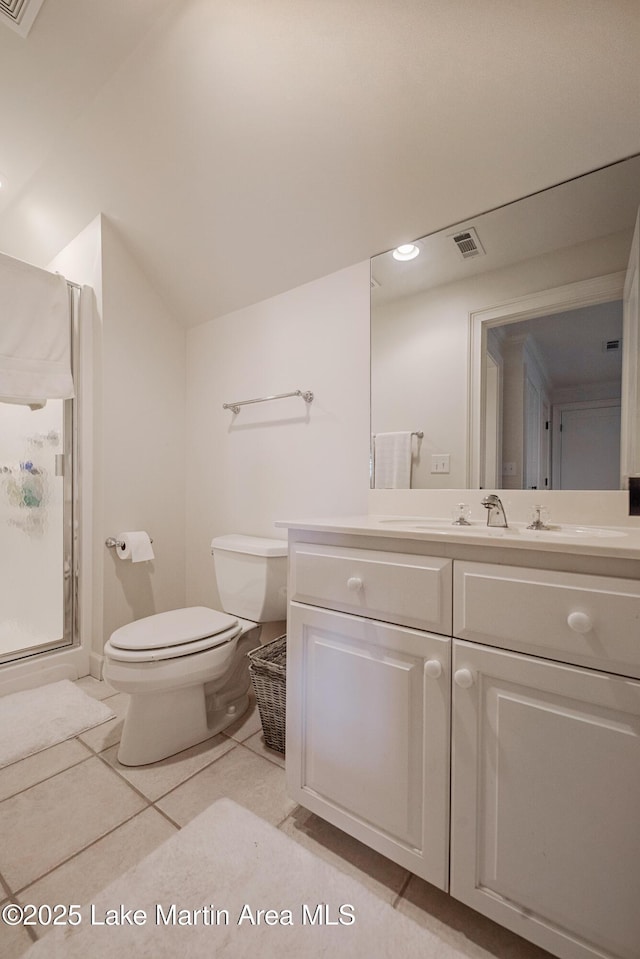 1220 Willow Way E, Alexander City, AL 35010 - bathroom featuring a stall shower, tile patterned floors, toilet, vanity, and visible vents