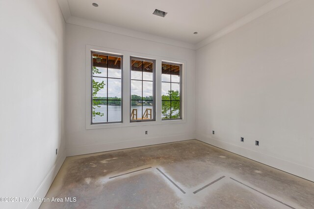 empty room featuring unfinished concrete floors and baseboards