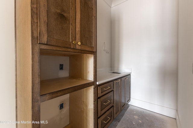 interior space with baseboards and concrete floors