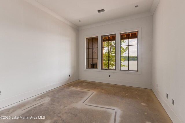empty room featuring baseboards and visible vents