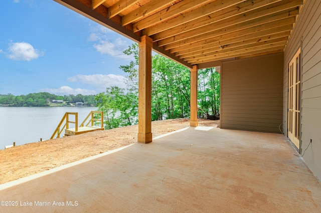 view of patio featuring a water view