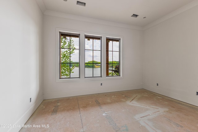 spare room with baseboards and visible vents