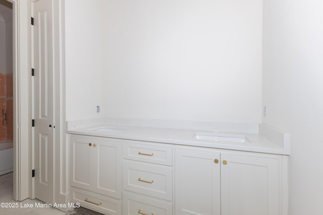 bathroom featuring dual sinks