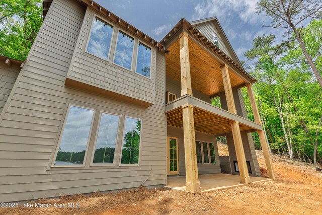 back of property featuring a patio area