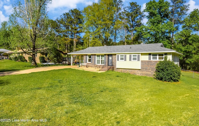 230 Lorena Dr, Alexander City, AL 35010 - ranch-style home with brick siding, a front lawn, and driveway