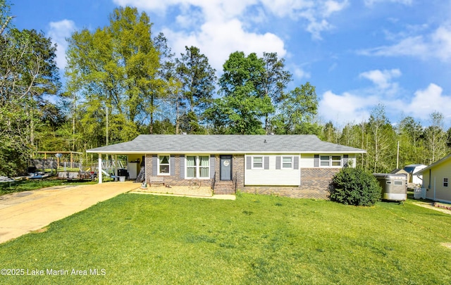 230 Lorena Dr, Alexander City, AL 35010 - ranch-style house with a carport, driveway, a front yard, and brick siding
