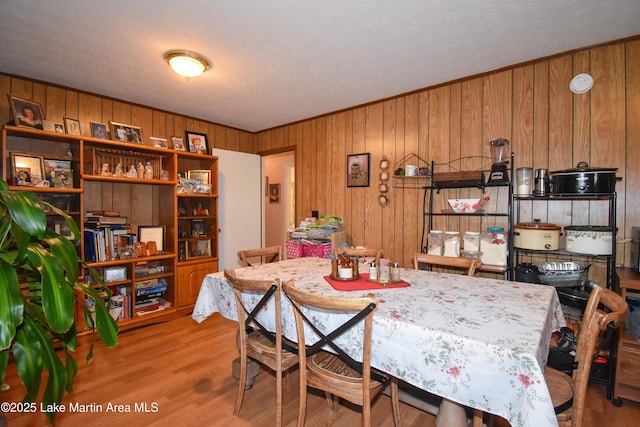230 Lorena Dr, Alexander City, AL 35010 - dining room featuring wood walls and wood finished floors