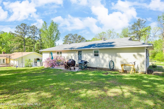 230 Lorena Dr, Alexander City, AL 35010 - back of house with a yard, fence, and a patio area