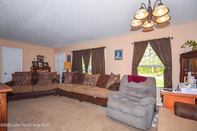 230 Lorena Dr, Alexander City, AL 35010 - living room featuring a chandelier, a textured ceiling, carpet flooring, and a wealth of natural light