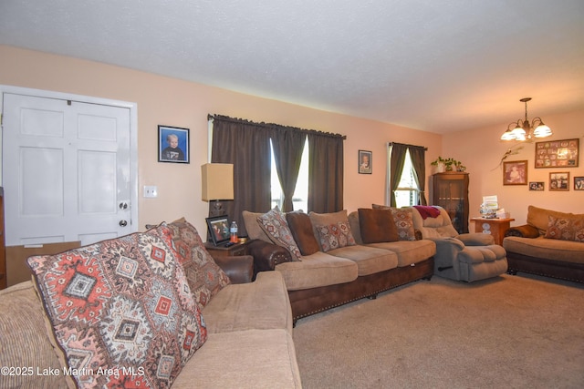 230 Lorena Dr, Alexander City, AL 35010 - living room with a notable chandelier and carpet floors