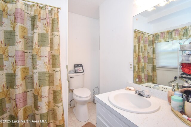 230 Lorena Dr, Alexander City, AL 35010 - full bath featuring tile patterned floors, toilet, a shower with shower curtain, and vanity