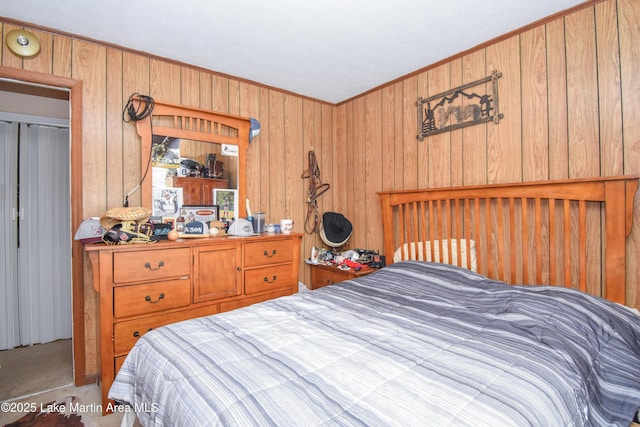 230 Lorena Dr, Alexander City, AL 35010 - bedroom featuring crown molding and wooden walls