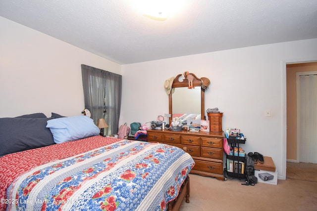 230 Lorena Dr, Alexander City, AL 35010 - bedroom with light colored carpet and a textured ceiling