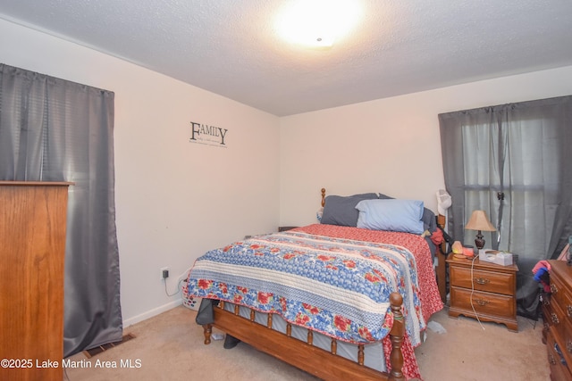 230 Lorena Dr, Alexander City, AL 35010 - bedroom with a textured ceiling, baseboards, and carpet