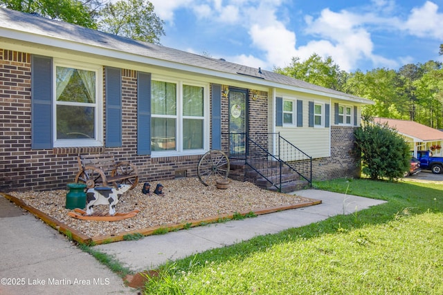 230 Lorena Dr, Alexander City, AL 35010 - single story home with a front lawn and brick siding