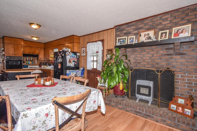 230 Lorena Dr, Alexander City, AL 35010 - dining area featuring a textured ceiling, wood finished floors, crown molding, and heating unit