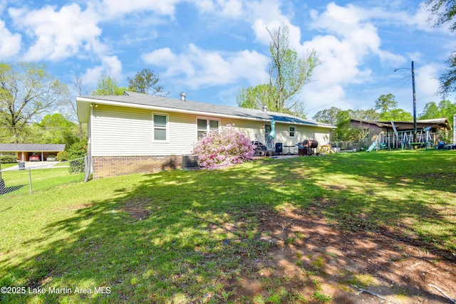 230 Lorena Dr, Alexander City, AL 35010 - back of house with cooling unit, fence, and a lawn