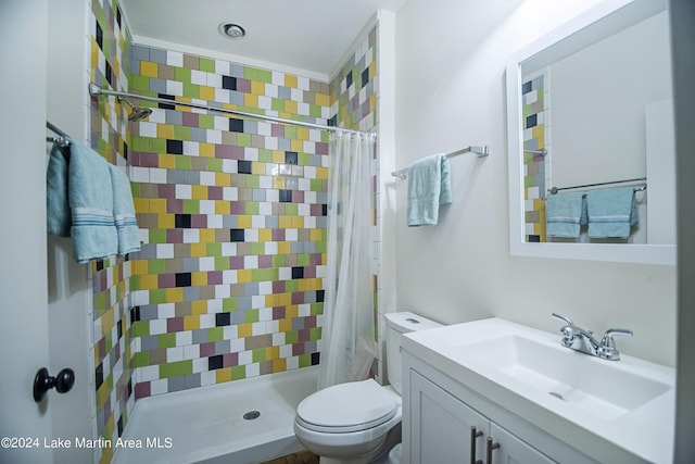 bathroom featuring vanity, a shower with shower curtain, and toilet