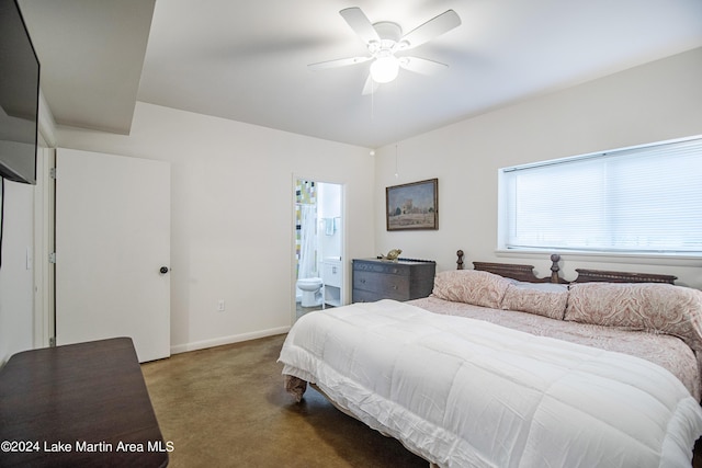 carpeted bedroom featuring ceiling fan and ensuite bathroom