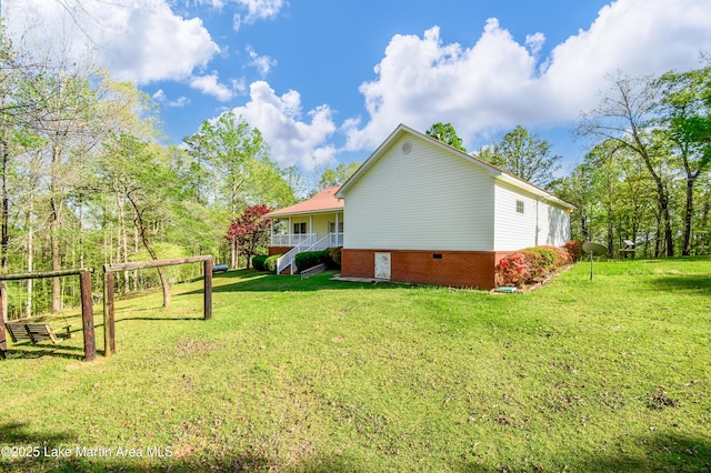 1647 Timber Trl, Alexander City, AL 35010 - view of home's exterior with a lawn and brick siding