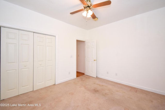 1647 Timber Trl, Alexander City, AL 35010 - unfurnished bedroom with a ceiling fan, baseboards, carpet, and a closet