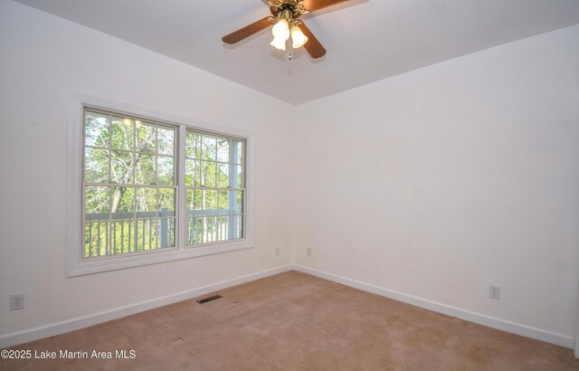 1647 Timber Trl, Alexander City, AL 35010 - unfurnished room with baseboards, visible vents, ceiling fan, and light colored carpet