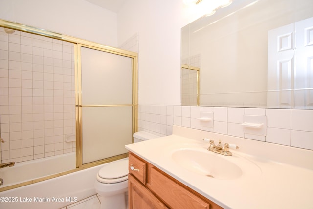 1647 Timber Trl, Alexander City, AL 35010 - full bath featuring tile walls, combined bath / shower with glass door, toilet, and vanity