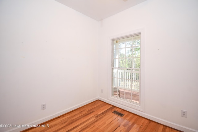 1647 Timber Trl, Alexander City, AL 35010 - spare room with visible vents, light wood finished floors, and baseboards