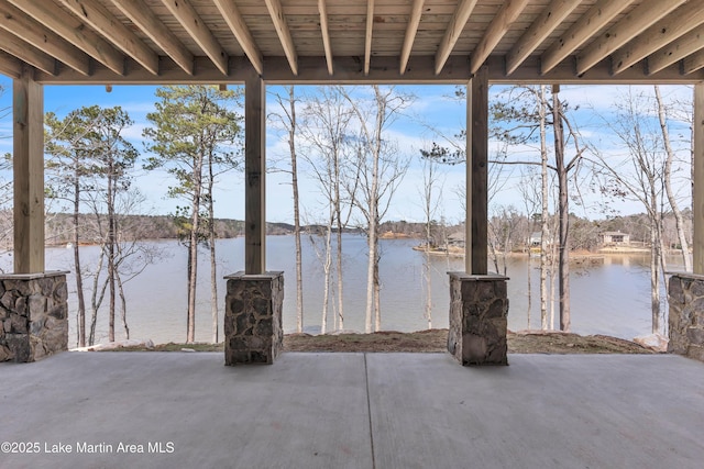 view of patio with a water view