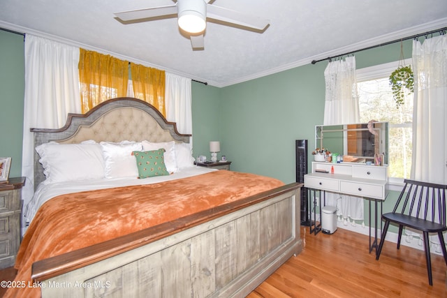 241 Warrior Rd, Alexander City, AL 35010 - bedroom featuring a ceiling fan, wood finished floors, and crown molding