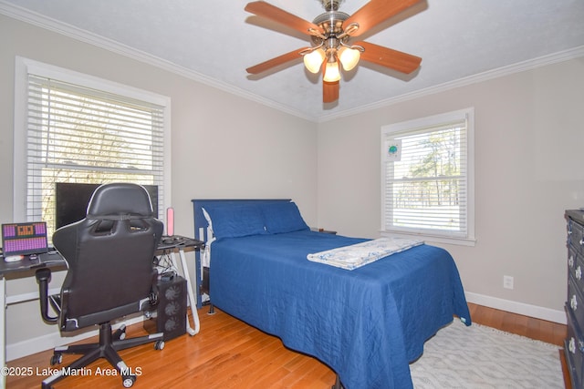 241 Warrior Rd, Alexander City, AL 35010 - bedroom with ceiling fan, crown molding, baseboards, and wood finished floors