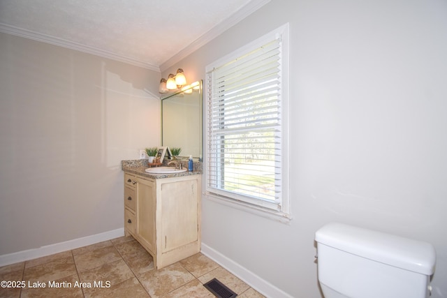 241 Warrior Rd, Alexander City, AL 35010 - bathroom with vanity, baseboards, visible vents, crown molding, and toilet