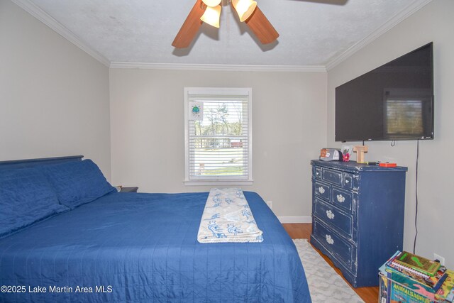 241 Warrior Rd, Alexander City, AL 35010 - bedroom featuring baseboards, crown molding, ceiling fan, and wood finished floors