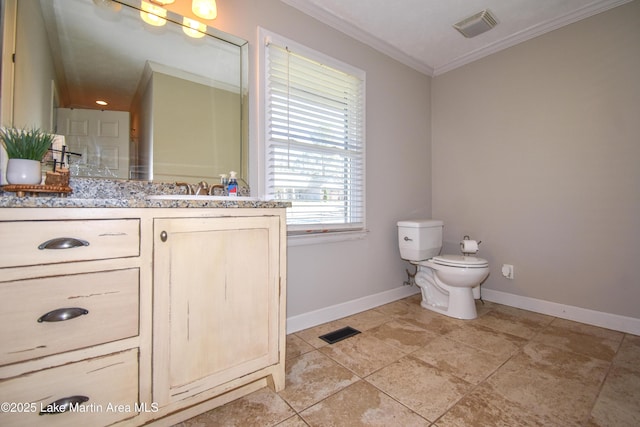 241 Warrior Rd, Alexander City, AL 35010 - bathroom featuring toilet, baseboards, visible vents, and ornamental molding