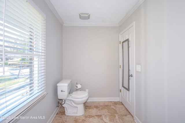 241 Warrior Rd, Alexander City, AL 35010 - half bath with crown molding, toilet, visible vents, and baseboards