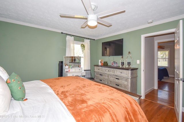 241 Warrior Rd, Alexander City, AL 35010 - bedroom featuring ornamental molding, a textured ceiling, baseboards, and wood finished floors
