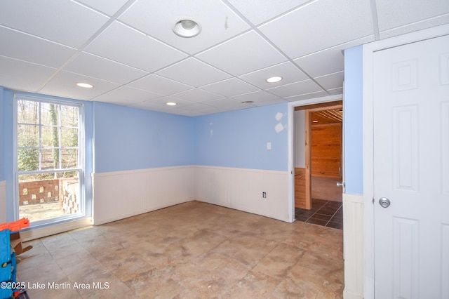 241 Warrior Rd, Alexander City, AL 35010 - unfurnished room with a drop ceiling, a wainscoted wall, and recessed lighting