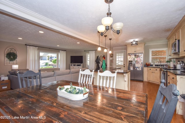 241 Warrior Rd, Alexander City, AL 35010 - dining space with recessed lighting, a textured ceiling, crown molding, a notable chandelier, and light wood-type flooring